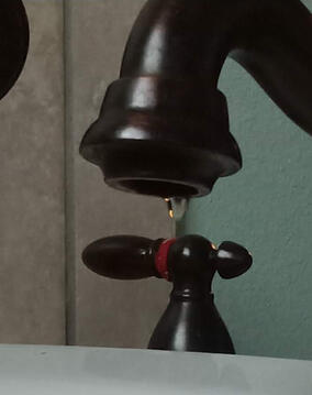 A photograph of a dripping sink.